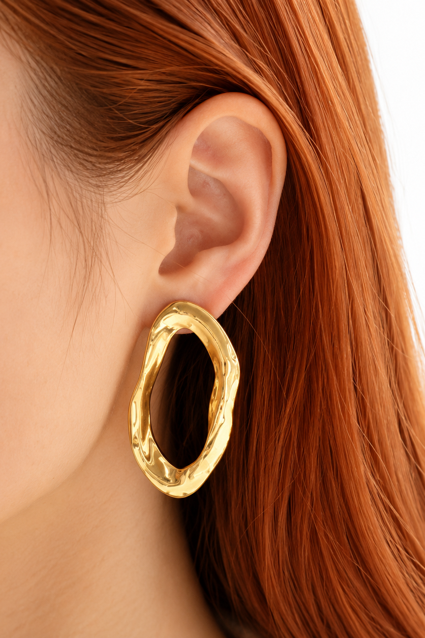 Boucles Thémis dorées en acier inoxydable au design organique