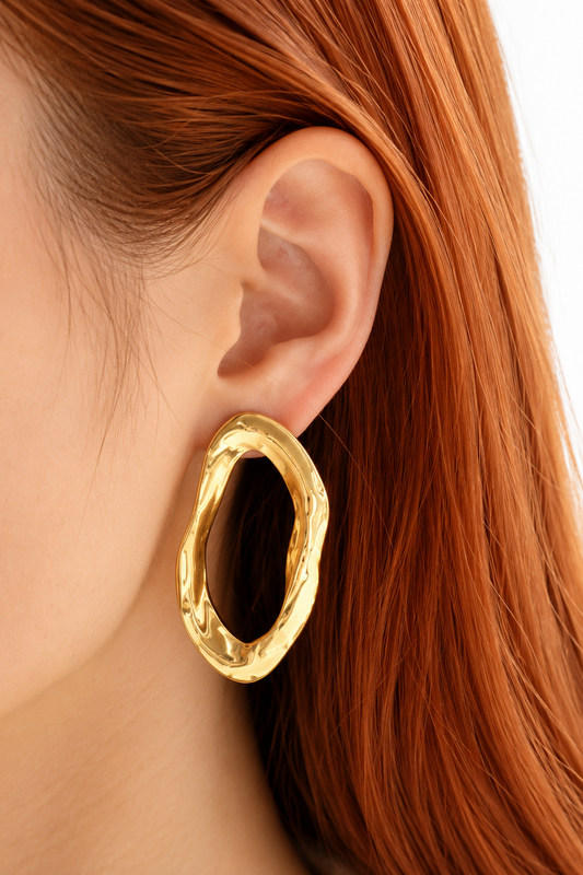 Boucles Thémis dorées en acier inoxydable au design organique