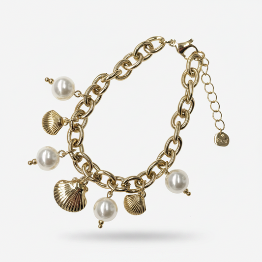 Bracelet Ondina doré perles et coquillages porté au poignet
